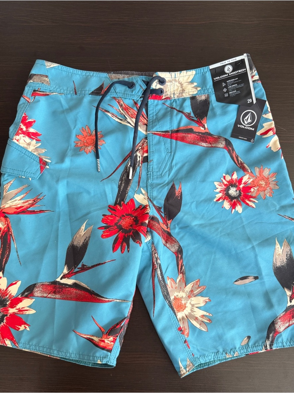 Volcom Men’s Turquoise Floral Board Shorts with Red Accents